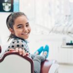 girl at dental office for fluoride treatment