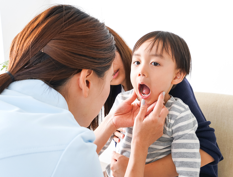 boy being examed by dentist