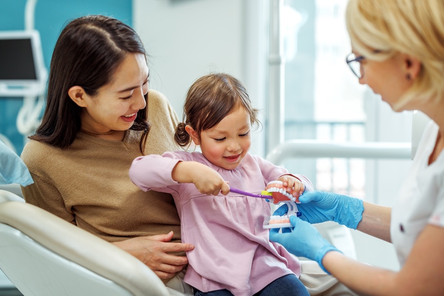 child at dentist for dental cleaning and exam