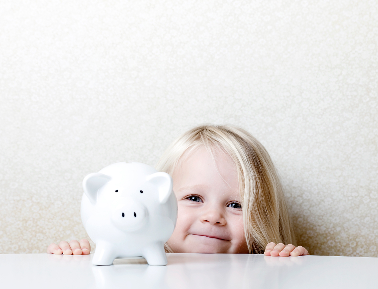 young girl with piggy bank