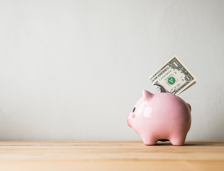 piggy bank with money sticking out