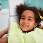child at dental office, special needs children may benefit from desensitizing the sounds of the dental office with practice at home