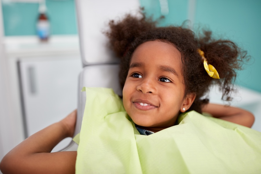child at dental office, special needs children may benefit from desensitizing the sounds of the dental office with practice at home