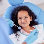girl getting dental work, pediatric dental crown covered by insurance